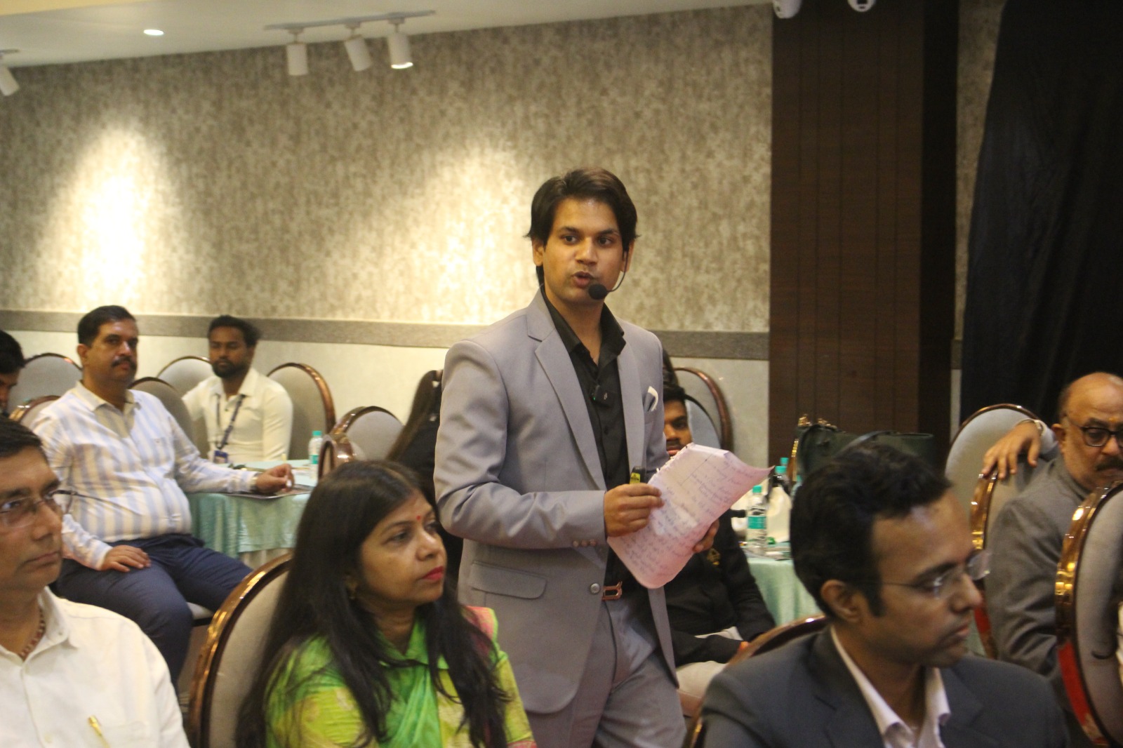 Audience applauding during seminar
